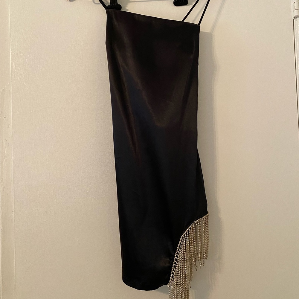 Small black dress with a bling on the bottom side as shown